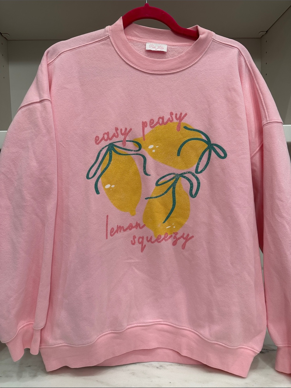 Pink Lily small pink sweatshirt. Easy peasy lemon squeeze logo. Like new